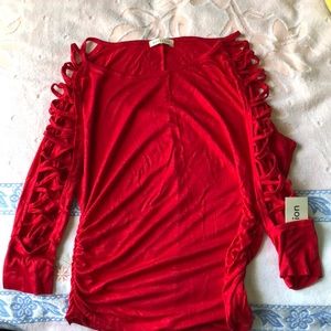 Long sleeve red shirt with crosses on the sleeves